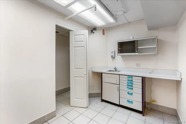 a view of a kitchen with a sink and dishwasher