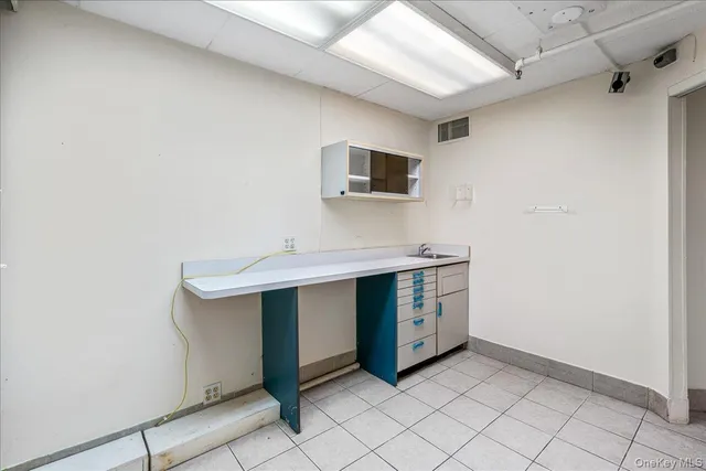 a kitchen with white cabinets