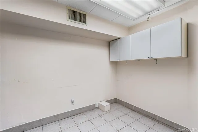 a hall with a stove and a microwave