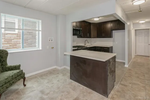 a kitchen with a stove and a refrigerator