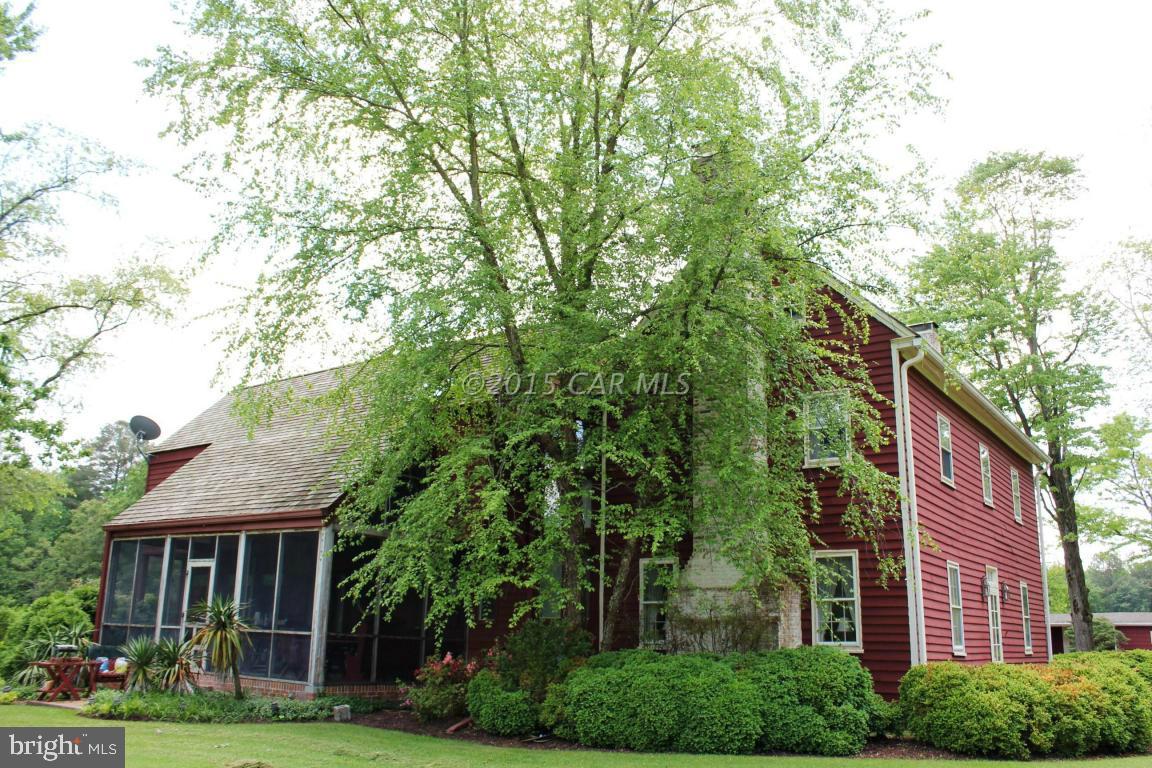 8579 Riggin Road Mardela Springs, MD 21837 - Photo 2 of 45 front view of a house with a tree