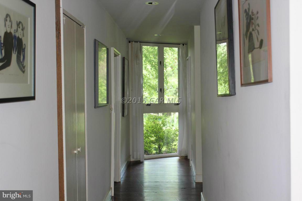 8579 Riggin Road Mardela Springs, MD 21837 - Photo 21 of 45 a view of an entryway with wooden floor and windows