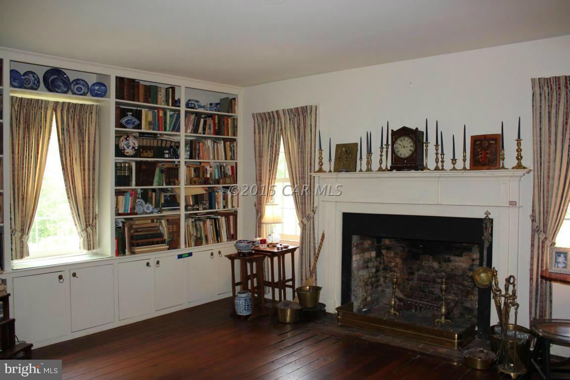 8579 Riggin Road Mardela Springs, MD 21837 - Photo 24 of 45 a living room with furniture and a fireplace