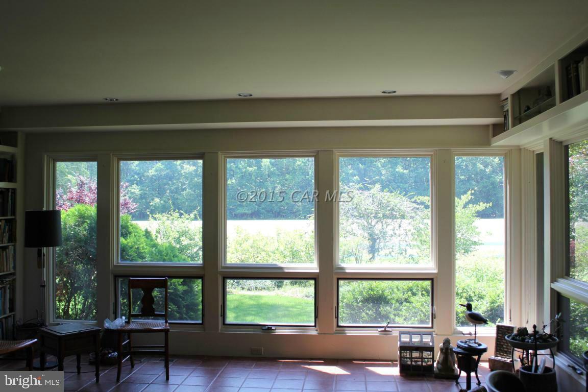 8579 Riggin Road Mardela Springs, MD 21837 - Photo 28 of 45 a living room with furniture and a window