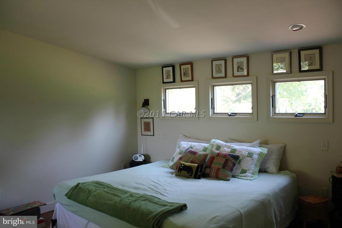 8579 Riggin Road Mardela Springs, MD 21837 - Photo 40 of 45 a bedroom with a bed and window