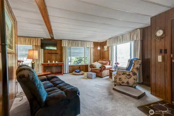 a bed room with furniture and a large window