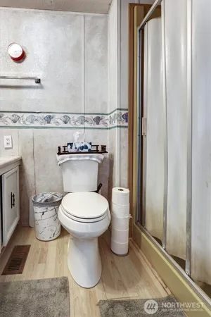 a bathroom with a toilet and a sink