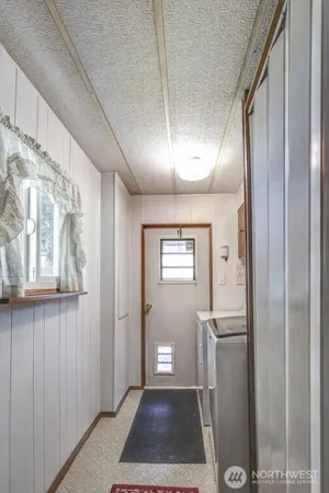 a view of a hallway with windows