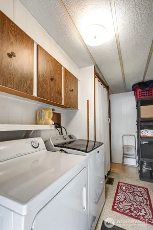 a kitchen with a appliances cabinets and a counter top space