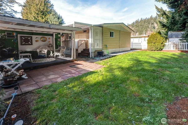 a front view of house with yard and trees