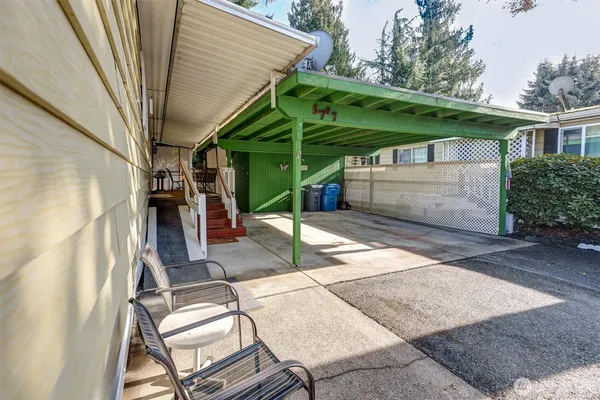 a view of a backyard with a patio and backyard