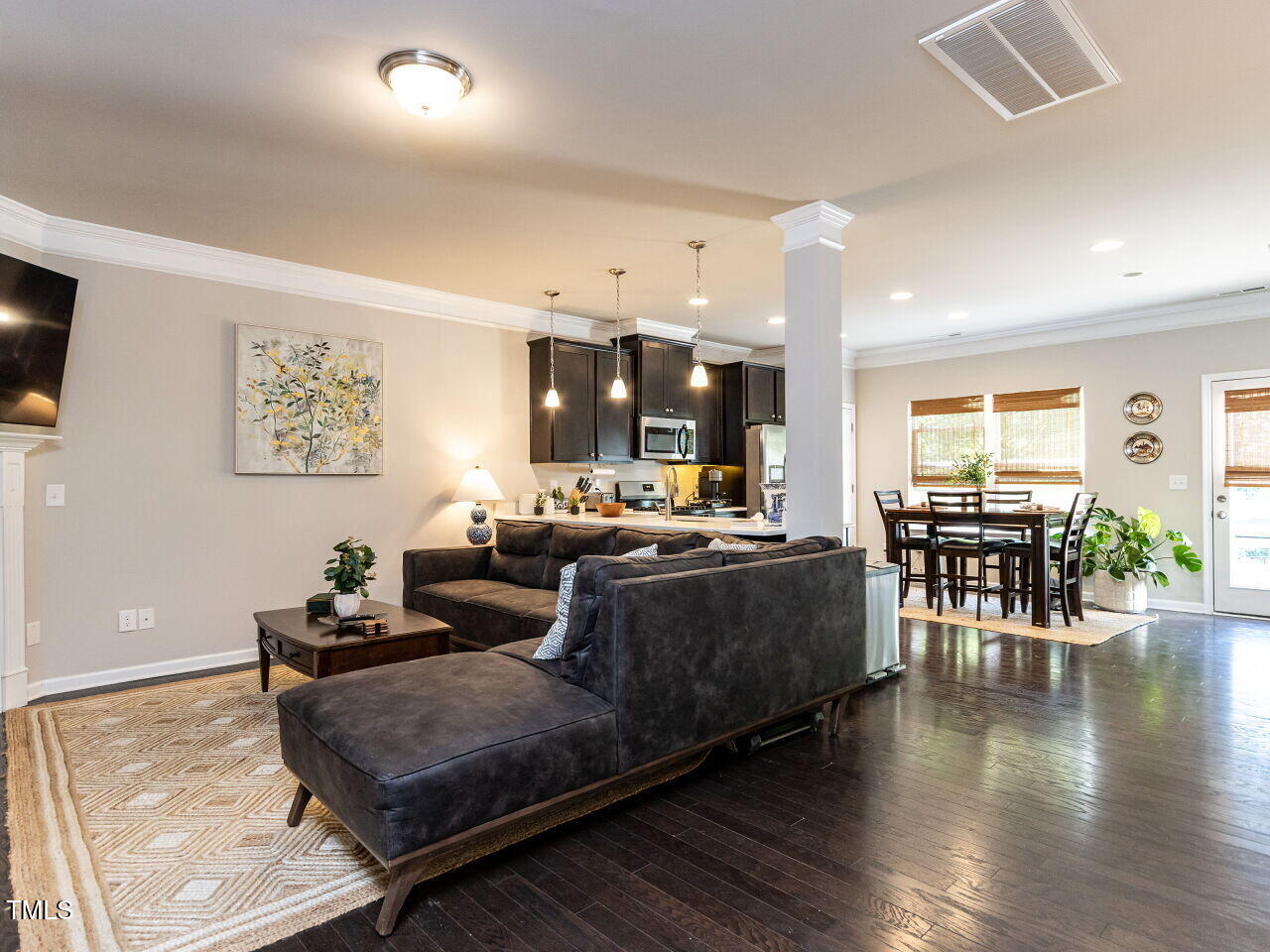 6341 Grace Lily Drive Raleigh, NC 27607 - Photo 9 of 29 a living room with furniture and wooden floors