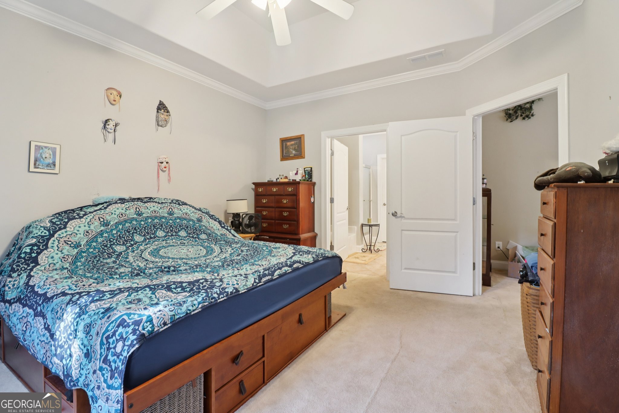 1502 Commonwealth Circle Newnan, GA 30263 - Photo 13 of 30 a spacious bedroom with a bed and a dresser