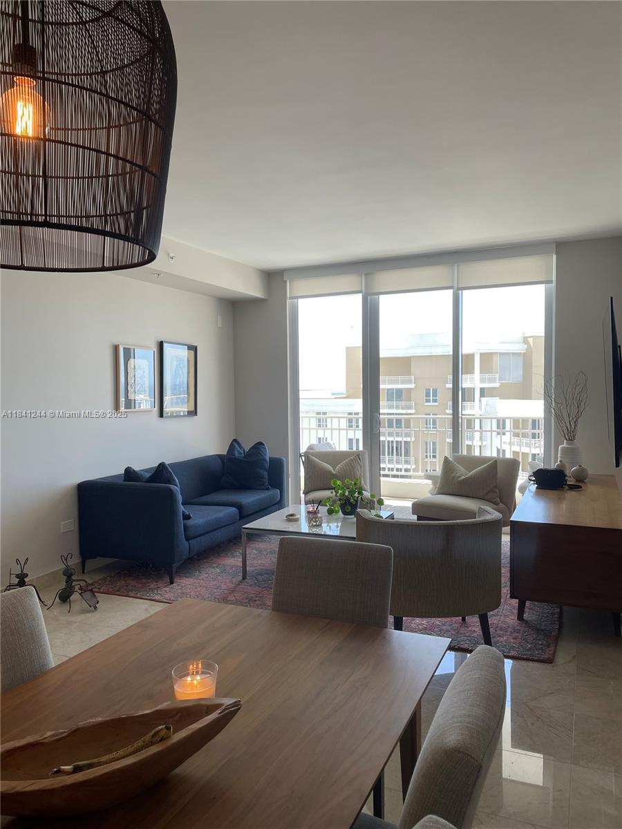 801 Brickell Key Boulevard, Unit 2705 Miami, FL 33131 - Photo 5 of 14 a living room with furniture