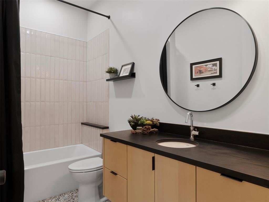 800 John Dean Road Gilmer, TX 75644 - Photo 37 of 40 a bathroom with a sink a toilet and a mirror