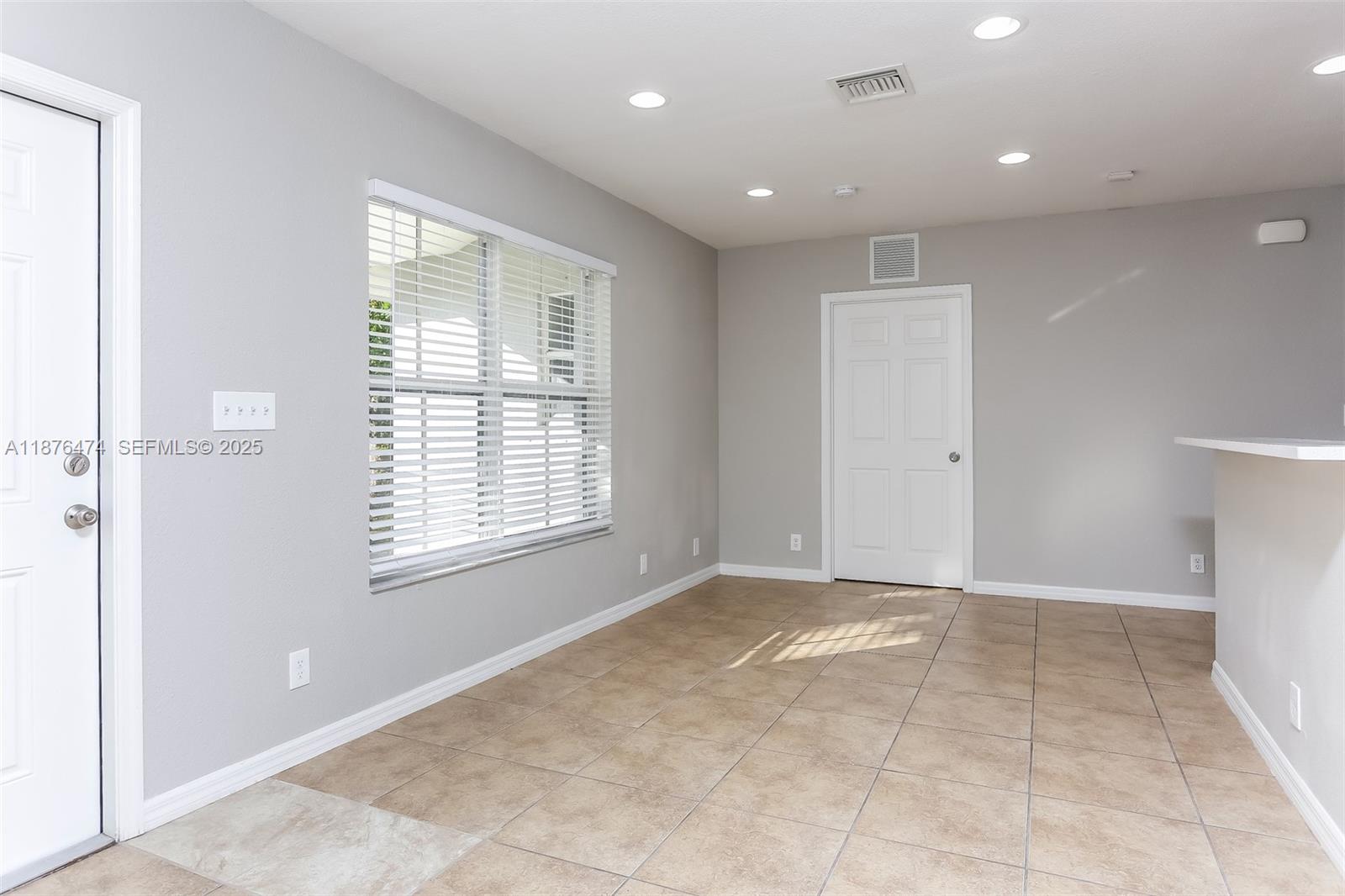 5819 Wilson Street Hollywood, FL 33021 - Photo 3 of 16 a view of an empty room with a window