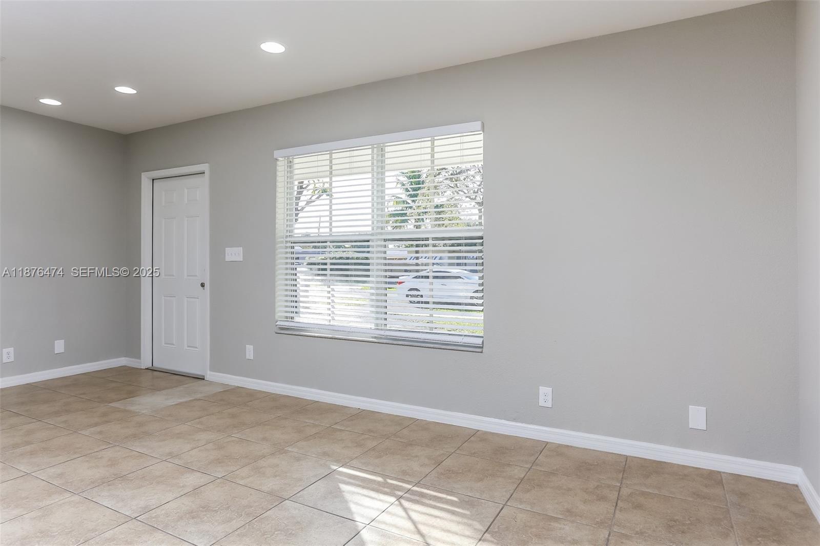 5819 Wilson Street Hollywood, FL 33021 - Photo 5 of 16 a view of an empty room with a window