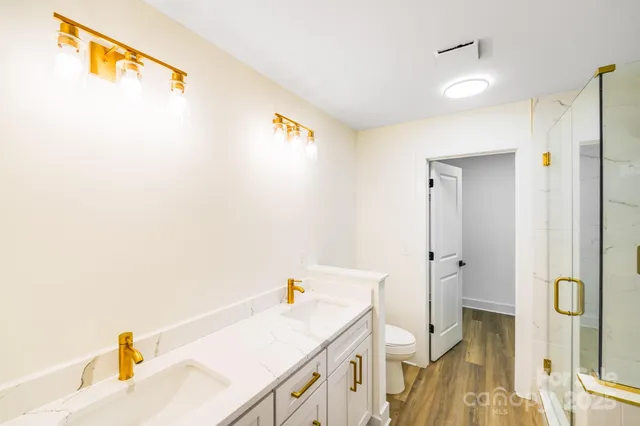 a bathroom with a sink and a shower