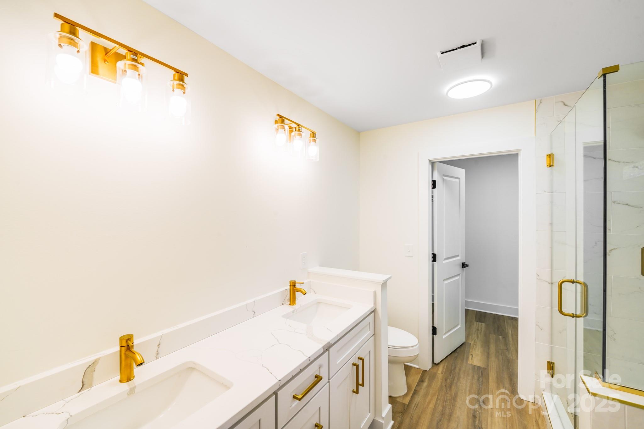 4538 Orphanage Road Concord, NC 28027 - Photo 8 of 14 a bathroom with a sink and a shower