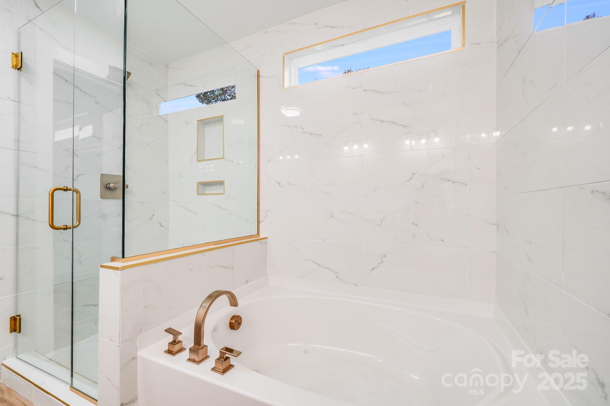 4538 Orphanage Road Concord, NC 28027 - Photo 9 of 14 a bathroom with a bathtub and shower