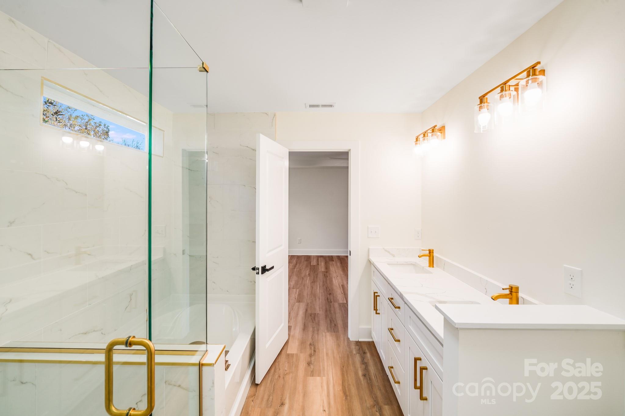 4538 Orphanage Road Concord, NC 28027 - Photo 10 of 14 a view of a bathroom with a tub and shower
