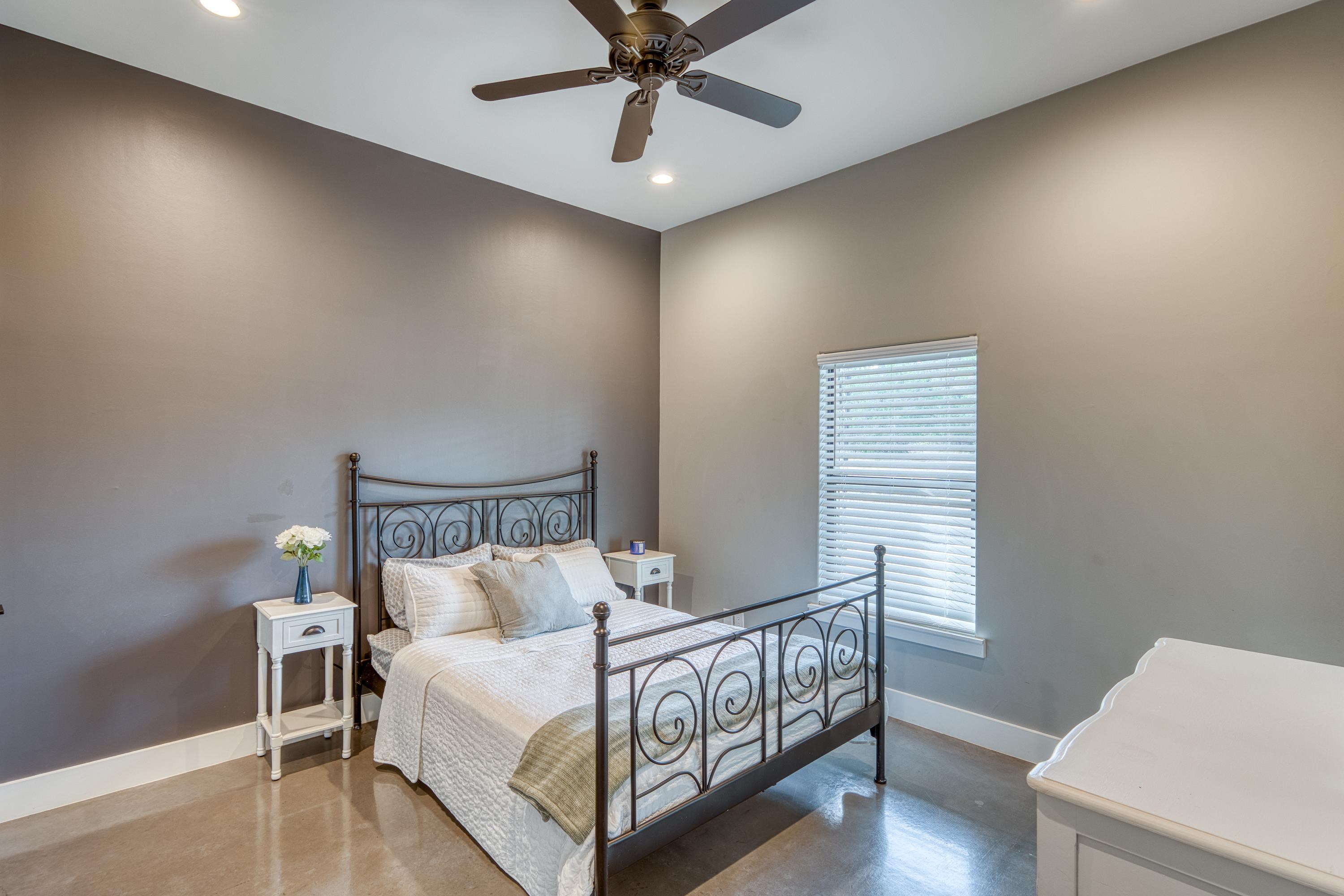 105 Keystone Buchanan Dam, TX 78609 - Photo 13 of 30 a bed room with a bed and a chandelier