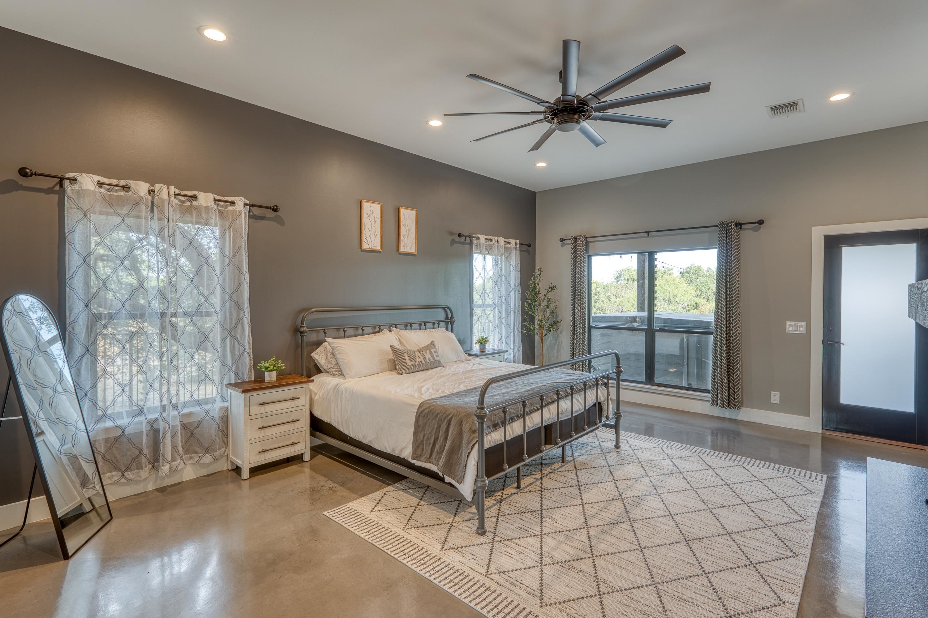 105 Keystone Buchanan Dam, TX 78609 - Photo 15 of 30 a bedroom with a bed and a large window