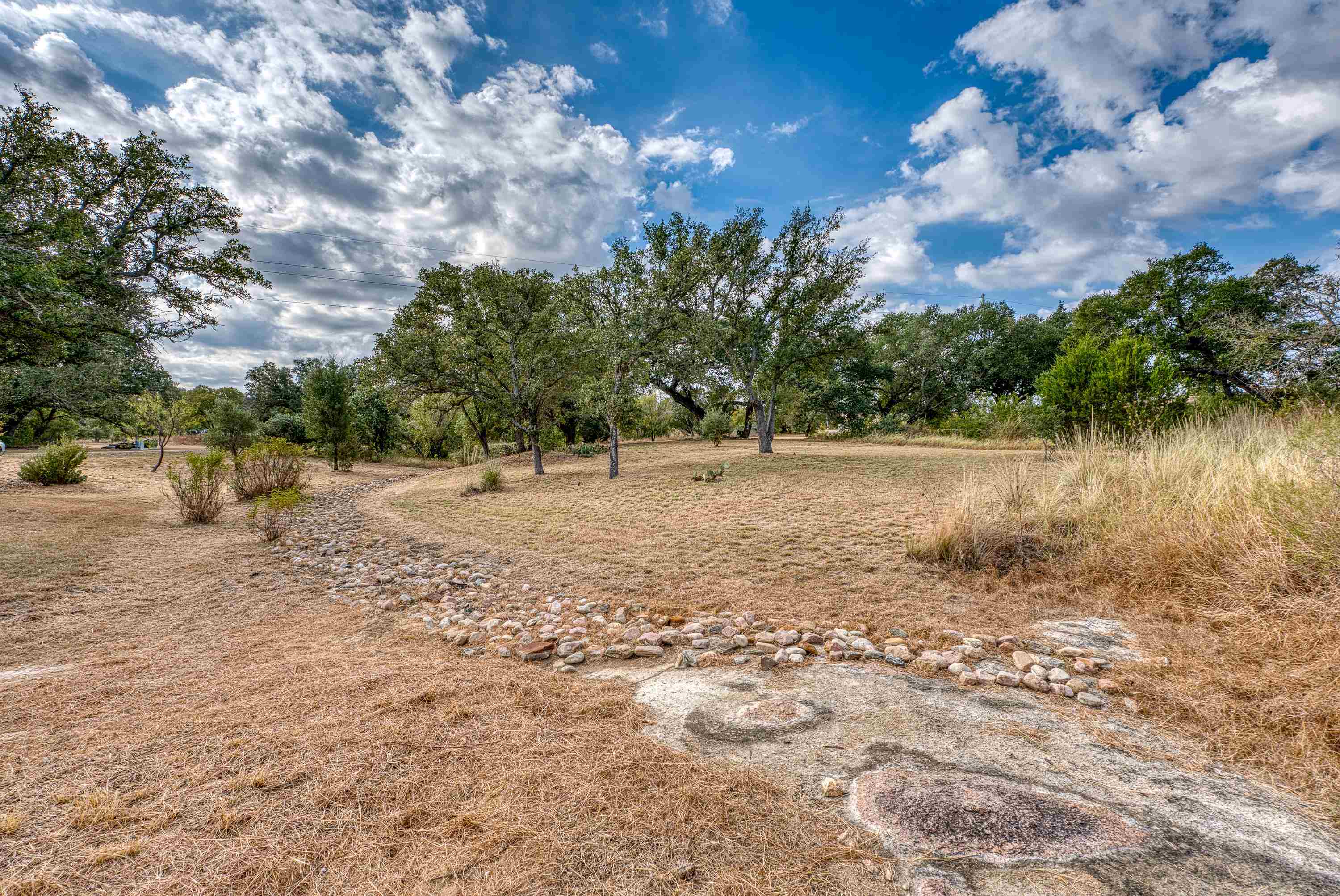 105 Keystone Buchanan Dam, TX 78609 - Photo 25 of 30 a view of a yard with a tree