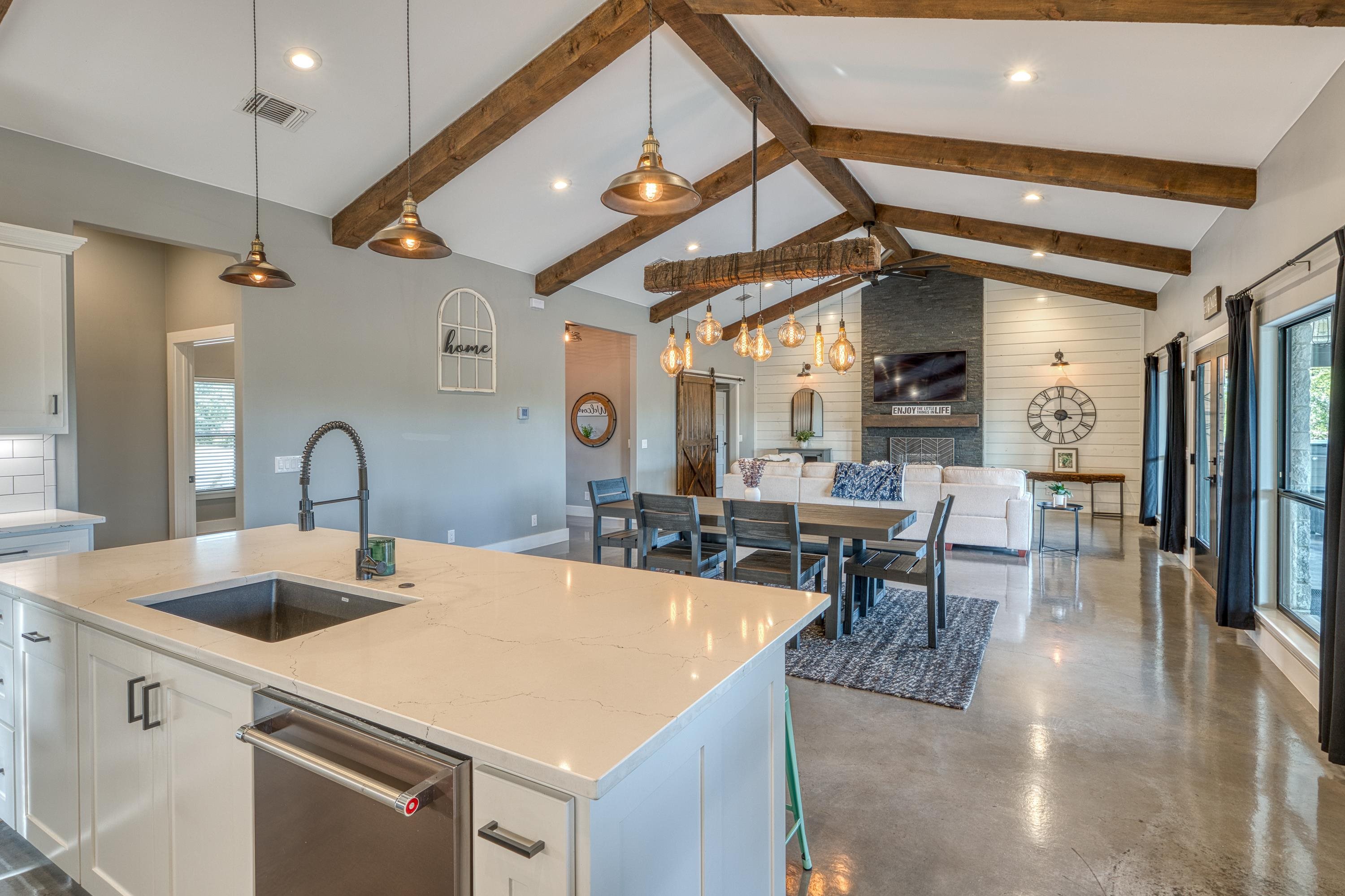 105 Keystone Buchanan Dam, TX 78609 - Photo 8 of 30 a kitchen with a table chairs and a wooden floor