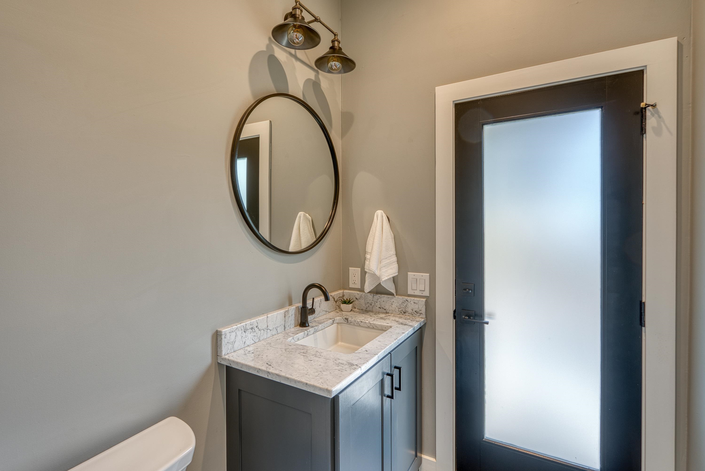 105 Keystone Buchanan Dam, TX 78609 - Photo 10 of 30 a bathroom with a toilet sink and mirror