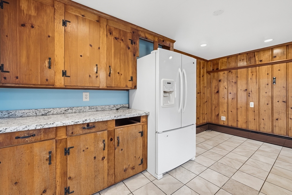 15 Lowell Avenue Holden, MA 01520 - Photo 15 of 42 a refrigerator freezer sitting inside of a kitchen