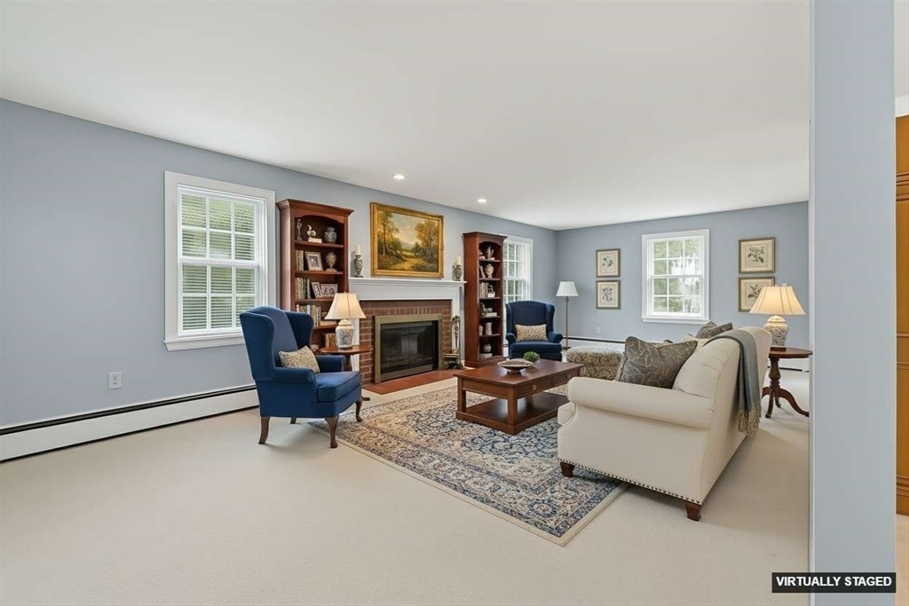 15 Lowell Avenue Holden, MA 01520 - Photo 19 of 42 a living room with furniture and a fireplace