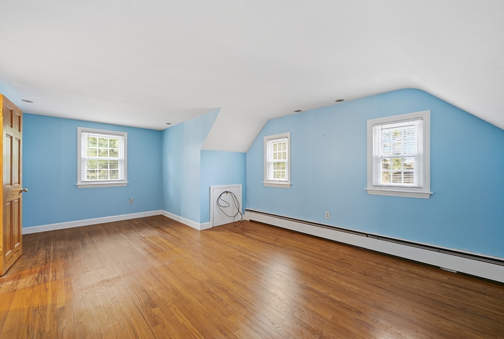 15 Lowell Avenue Holden, MA 01520 - Photo 5 of 42 a view of an empty room with wooden floor and a window