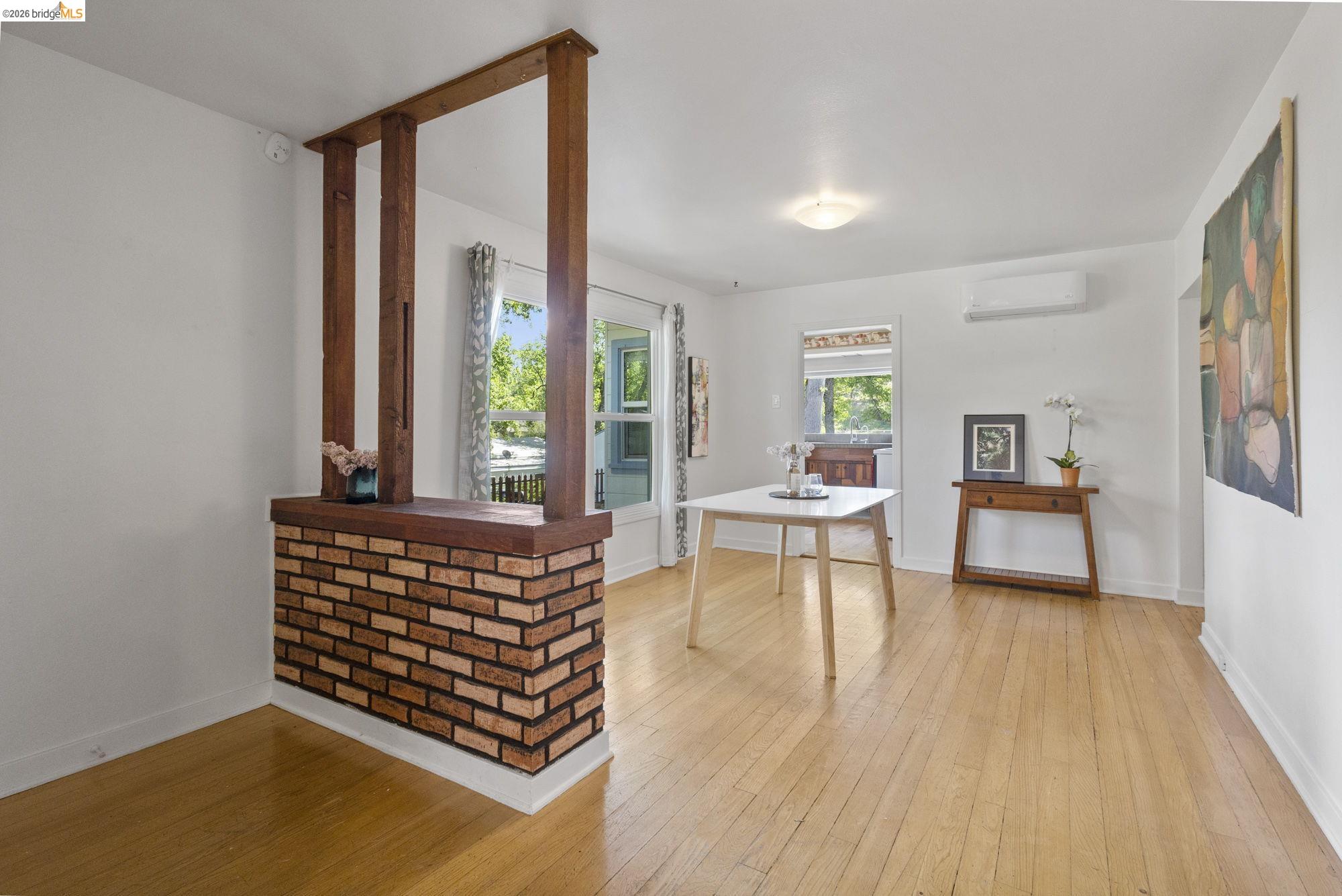 18363 Yosemite Road Tuolumne, CA 95379 - Photo 4 of 34 Open-concept room featuring wood-finish flooring, white walls, and a recessed ceiling light