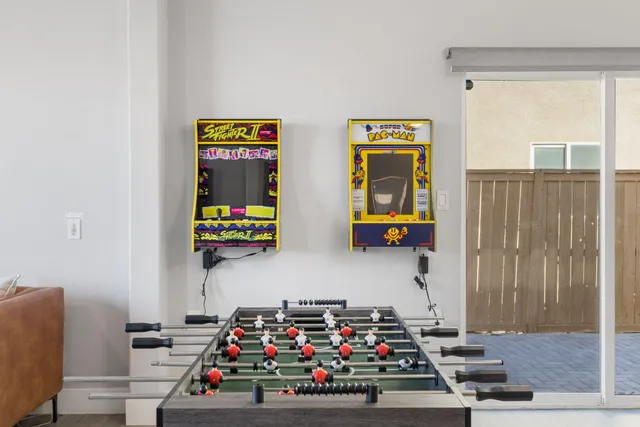 a view of kids room with toys and a window