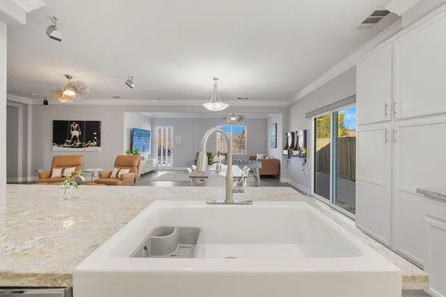 a view of living room with furniture and a chandelier