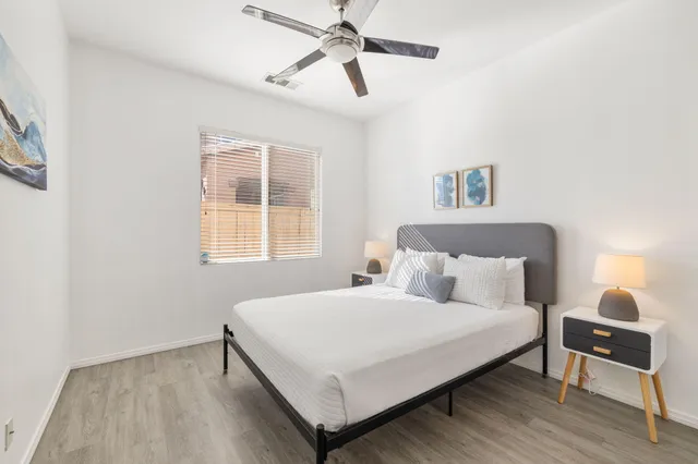 a bedroom with a bed and a window