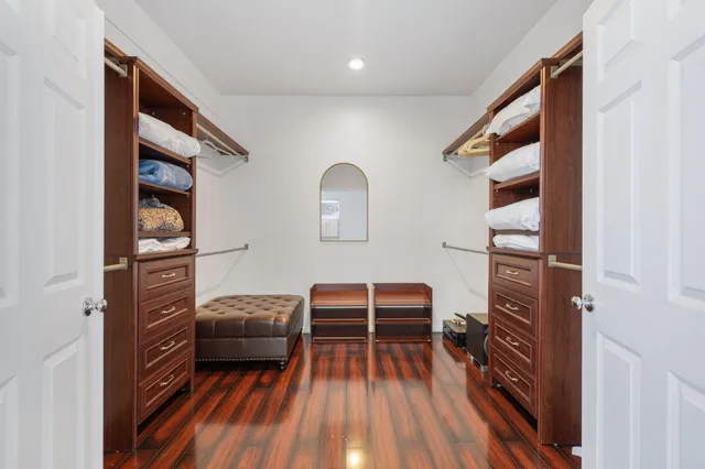 a view of living room with furniture and wooden floor