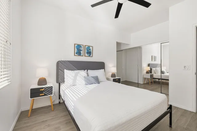 a large bed in a white room