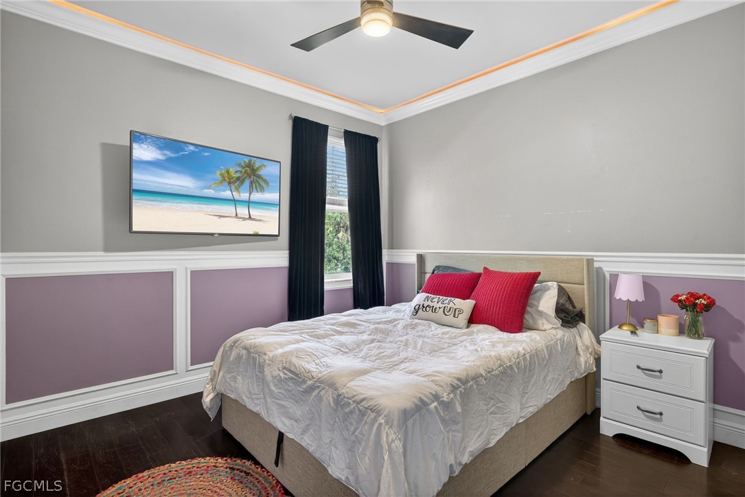 22866 Forest Ridge Drive Estero, FL 33928 - Photo 25 of 38 a bedroom with a bed and a painting on the wall
