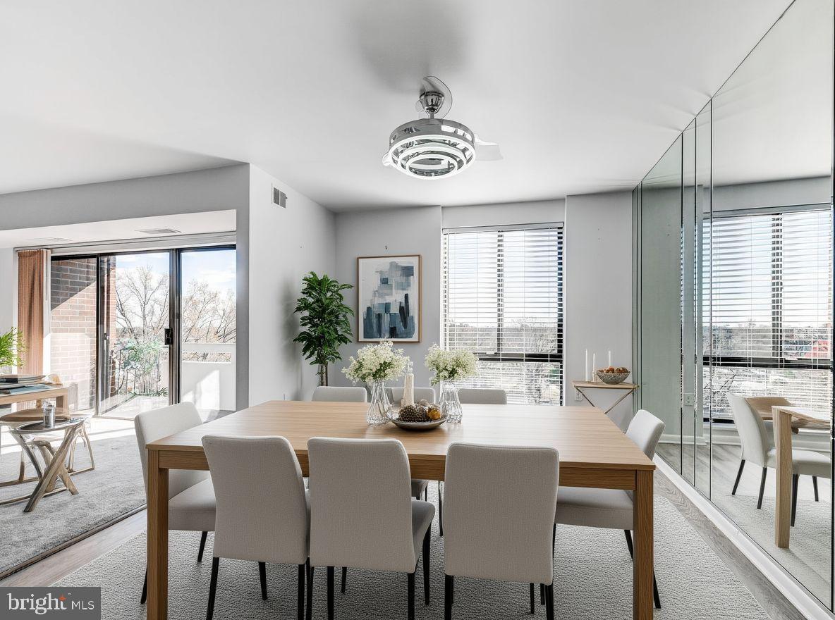 7 Slade Avenue, Unit 718 Pikesville, MD 21208 - Photo 11 of 58 a view of a dining room with furniture window and outside view