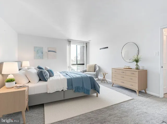 a bedroom with bed and window