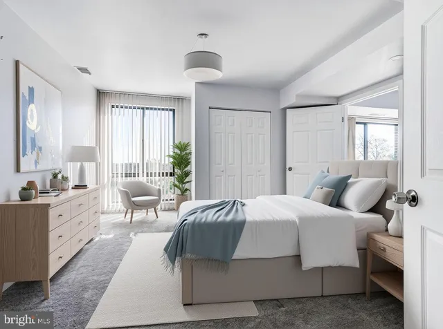 a bedroom with a large bed and a couch