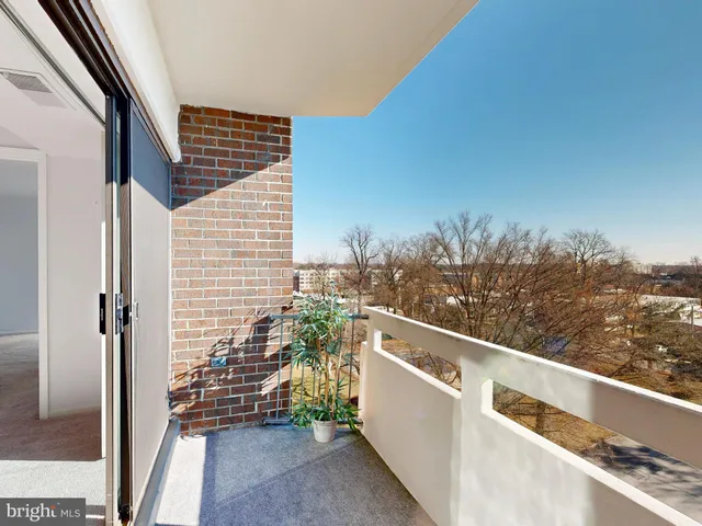 a view of balcony with furniture