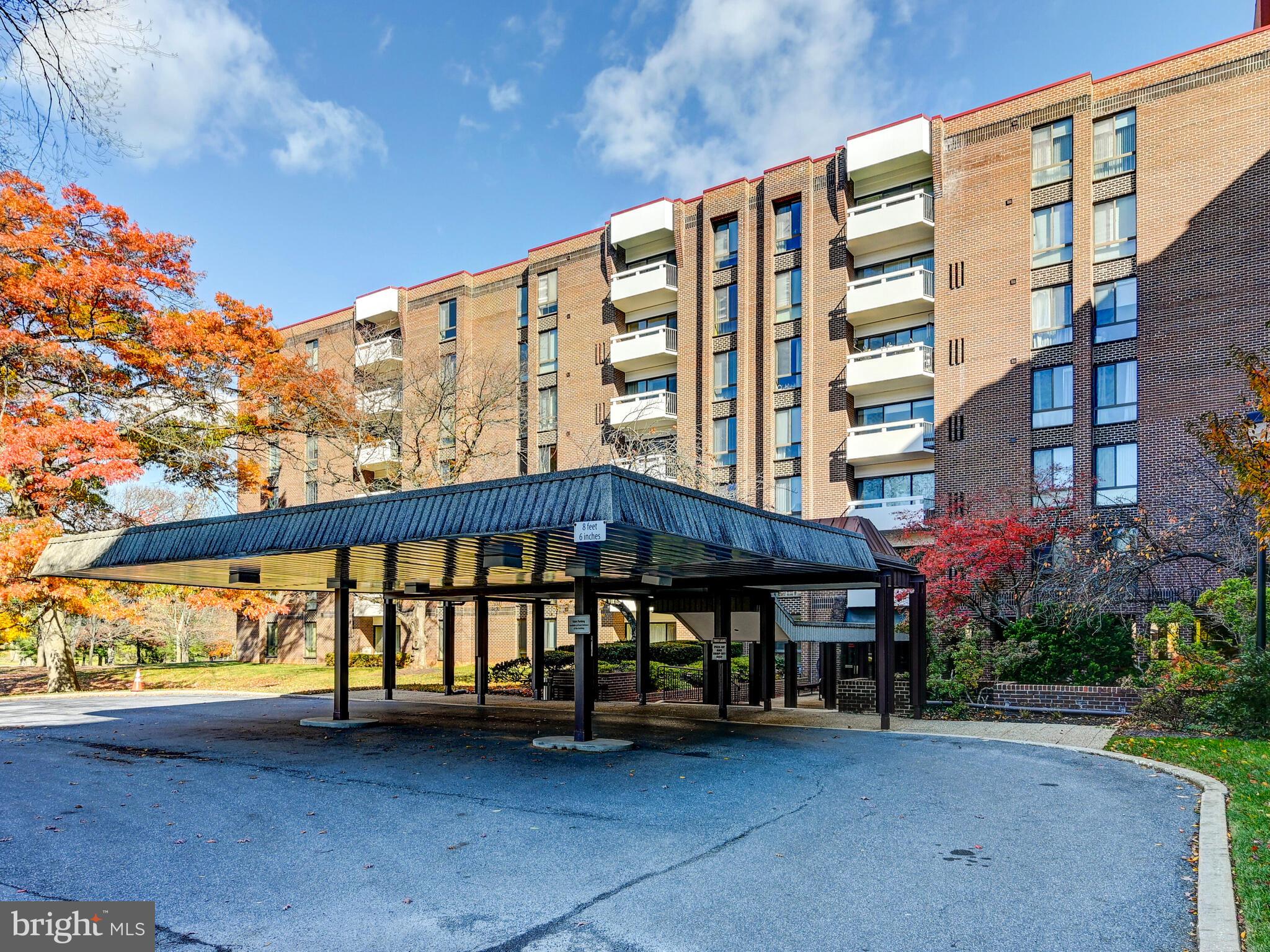 7 Slade Avenue, Unit 718 Pikesville, MD 21208 - Photo 23 of 58 a view of building with yard and sitting area