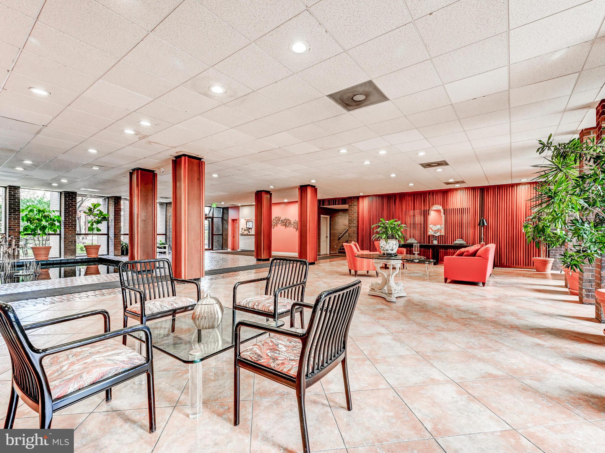 7 Slade Avenue, Unit 718 Pikesville, MD 21208 - Photo 28 of 58 a living room with furniture and a fireplace