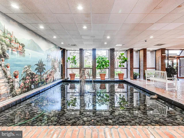 a view of a living room and chandelier