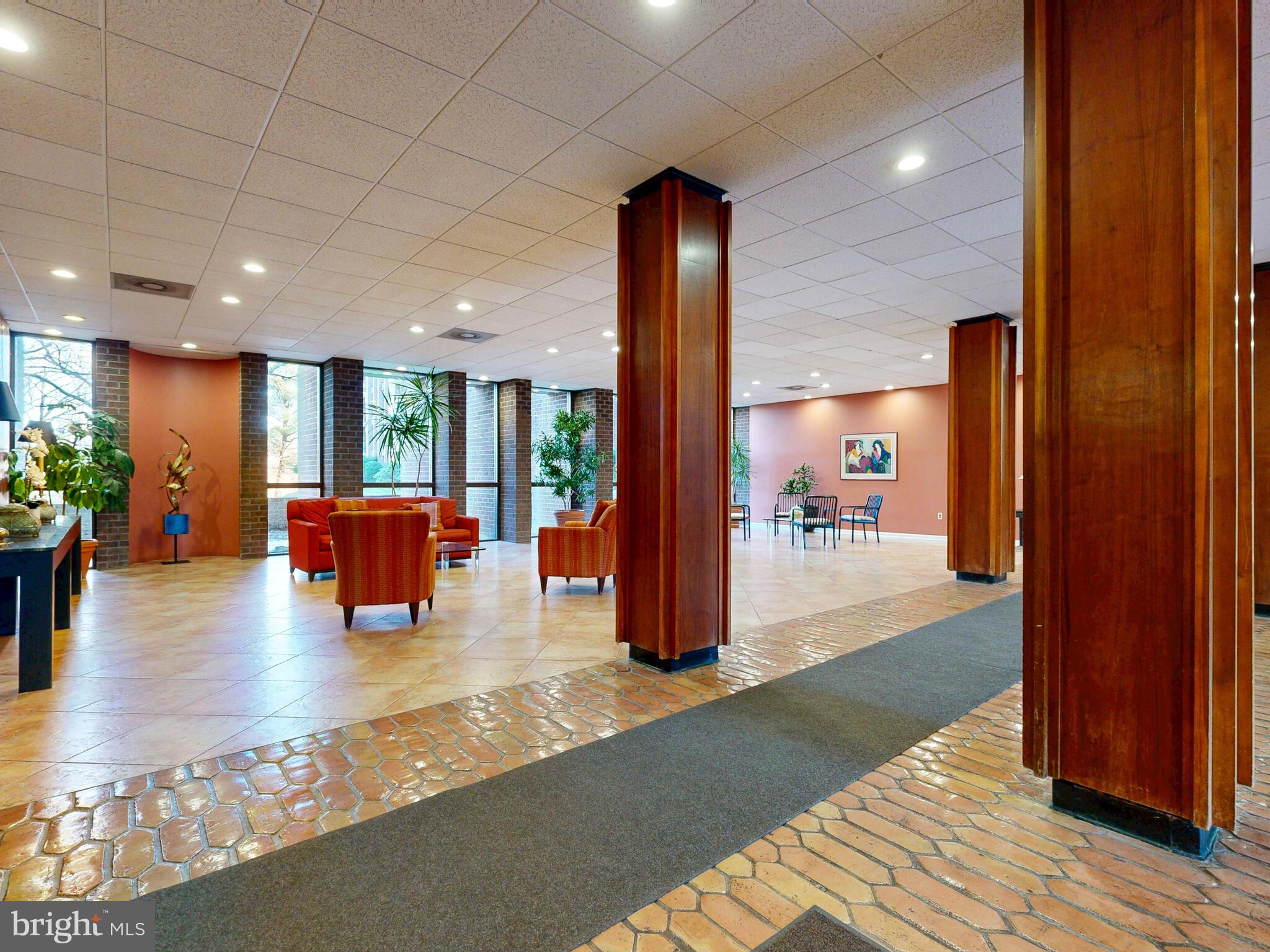 7 Slade Avenue, Unit 718 Pikesville, MD 21208 - Photo 33 of 58 a view of a living room with hardwood floor and a kitchen view
