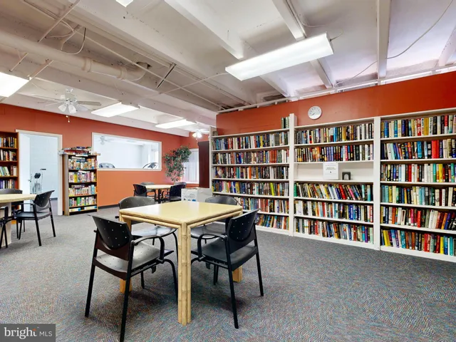 a view of a park with bench and trees