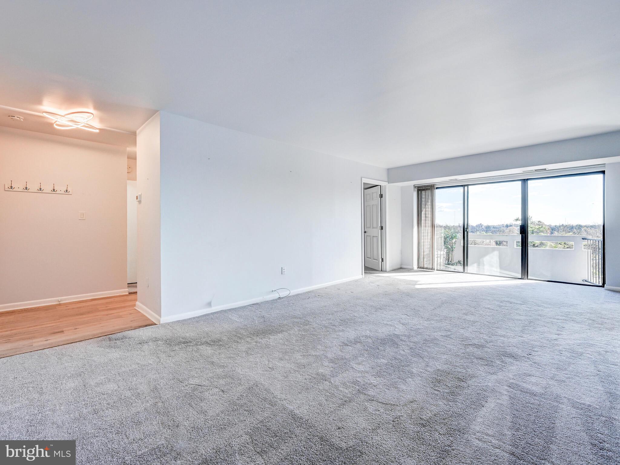 7 Slade Avenue, Unit 718 Pikesville, MD 21208 - Photo 43 of 58 a view of an empty room with a window